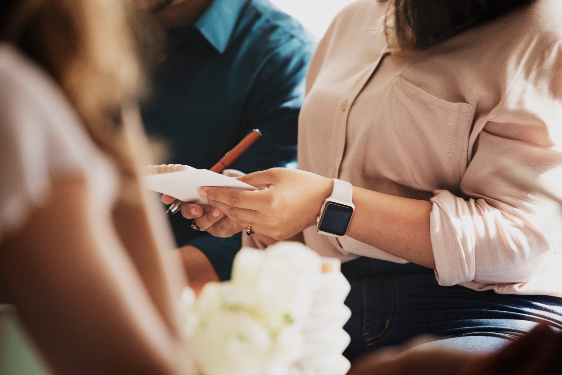 Venue management team brainstorming and taking notes during an event meeting
